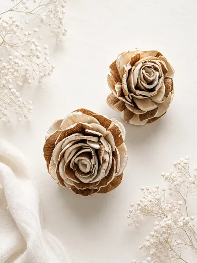 Hand-shaped sola roses in natural ivory with bark-tipped petals