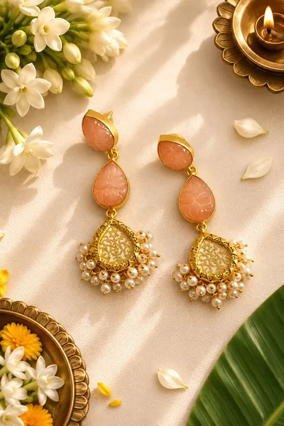 Handcrafted earrings with carved peach stones and pearl fringe